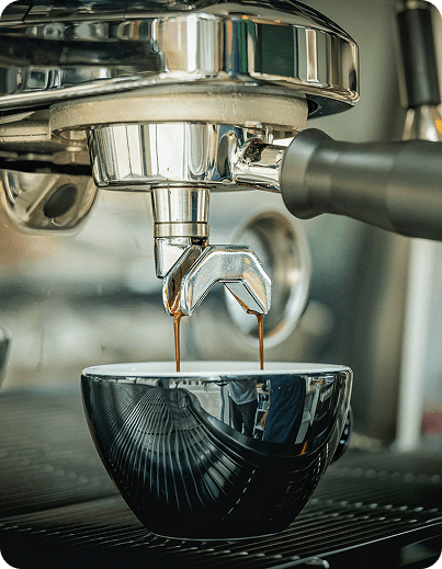 Espresso being poured into a cup